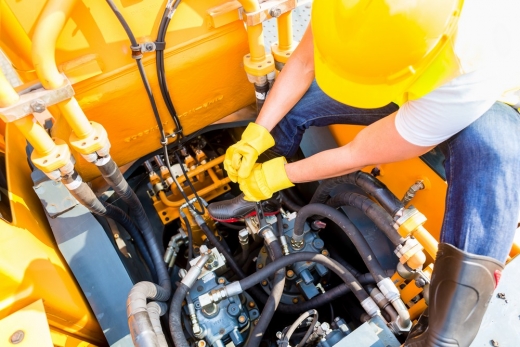 6 reasons to conduct maintenance on your heavy machinery - motor mechanic working in vehicle workshop