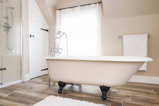 Bathtub, clawfoot or claw foot bath in a luxury bathroom, UK
